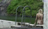 Naked Mike Monroe bathes in the river