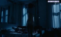 Marina Konyashkina lies naked in bed