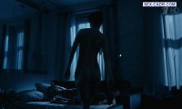 Marina Konyashkina lies naked in bed