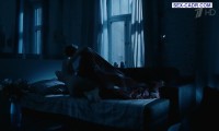 Marina Konyashkina lies naked in bed